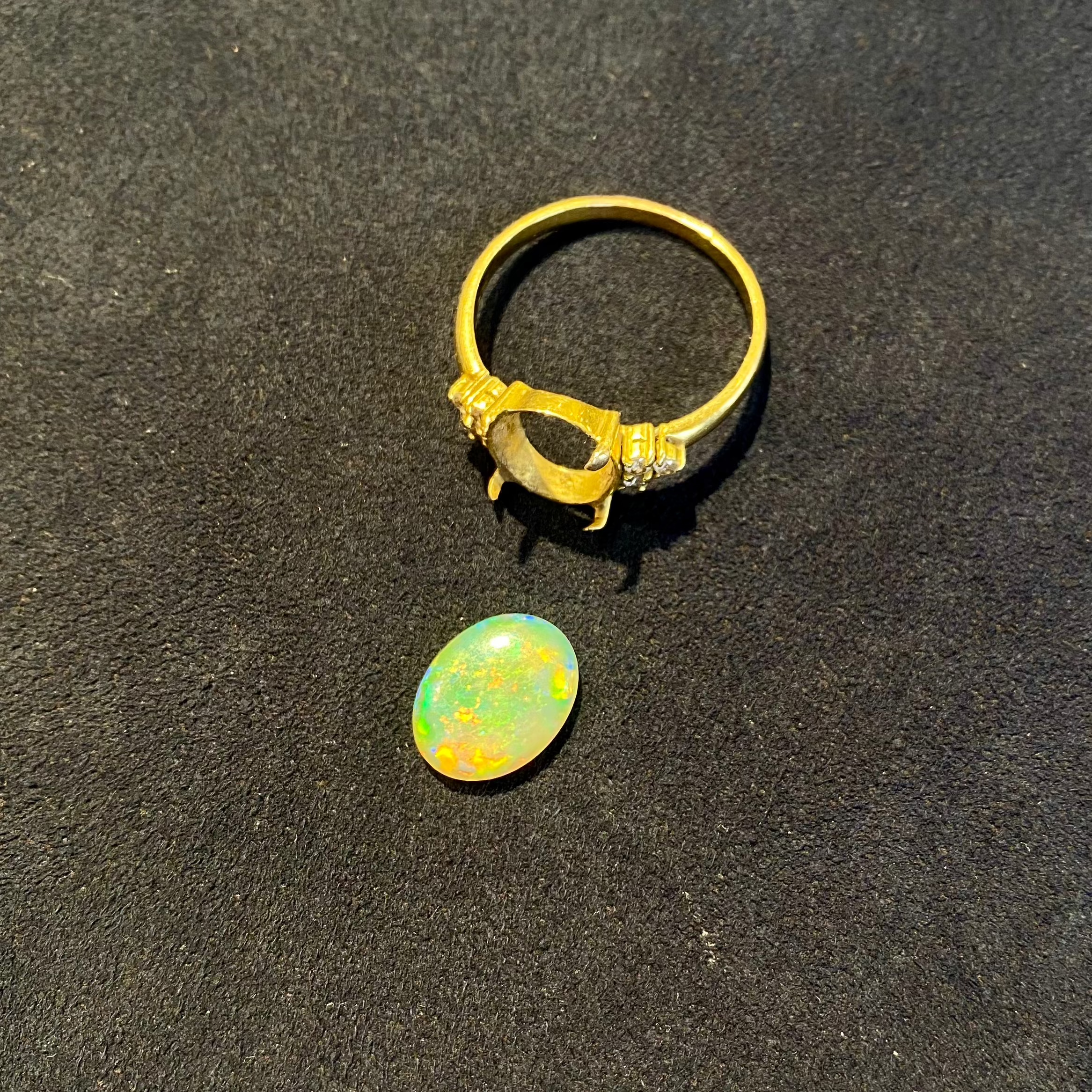 Australian opal ring needing to be repaired.