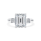 Trista - Micheli Jewellery, emerald cut diamond trilogy ring. trilogy ring profile. baguette diamond side stone ring. white gold trilogy ring. emerald cut trilogy ring. art deco styled ring. white gold 4 claw trilogy ring with emerald radiant cut diamond and baguette diamond side stones. 