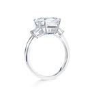 Trista - Micheli Jewellery, trilogy ring side profile. emerald cut trilogy ring on the side. baguette diamond ring on side. white gold trilogy ring side profile. floating setting engagement ring on the side. 